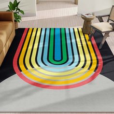 a living room area with a colorful rug on the floor