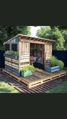 a small wooden shed sitting on top of a lush green field