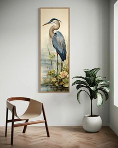 a painting hanging on the wall next to a chair and potted plant in a room