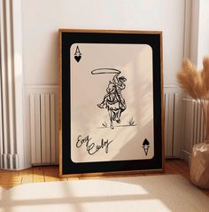 a framed drawing of a cowboy holding a lasso