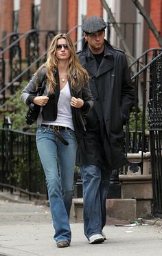 a man and woman walking down the street