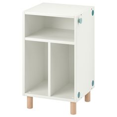 a white cabinet with two open compartments on one side and three wooden legs on the other