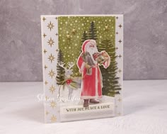 a christmas card with santa holding a bag