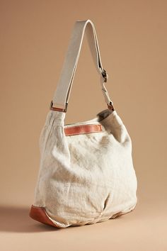 Natural: Hemp; leather trim Navy, Carbon: Cotton, hemp; leather trim Two inner slip pockets One inner zip pocket One inner key fob clasp Snap styling Machine wash Imported | Canvas Crossbody Bucket Bag by 49 Square Miles in Beige, Women's, Cotton/Leather at Anthropologie Linen Handbags, Lighted Canvas, Leather Trims, Bucket Bag, Women's Accessories, Zip Pockets, Leather Straps, Crossbody Bag, Bag Accessories