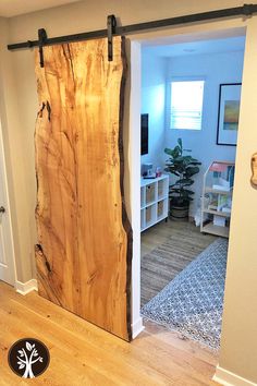 the sliding door is made out of wood and has metal hardware on it, along with a rug