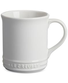 a white coffee cup with the word mergreist on it's side, sitting in front of a white background