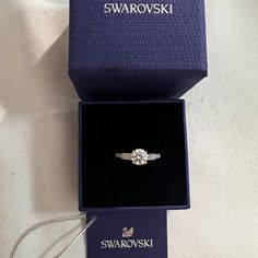 Swarovski Crystal Attract Ring Size 5.5. Brand New With Tag. Offers Welcome! See Our Photos For Details. Item #05759862 From Swarovski, This Ring Features: Swarovski's Attract Round Ring Is A Truly Romantic Gift. This Stunning, Rhodium-Plated Ring Features A Round Crystal In The Center With Sparkling Crystals On Either Side. The Crystals Embellish The Front Half Of The Ring. The Perfect Jewelry Piece For Day Or Evening Outfits! Rhodium-Plated Metal Swarovski Crystal Swarovski Crystals Rings, Swarovski Promise Ring, Swarovski Ring Aesthetic, Swarovski Ring Engagement, Swarovski Jewelry Aesthetic, Swarovski Aesthetic, Girlfriend Proposal, Swarovski Rings, Female Rings