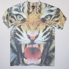 Small Detroit Or Carolina Tigers Unisex Gift T-Shirt Tiger Roar Adult Top. Pit To Pit 18" Length 26" Roaring Big Cat Kitty Kitten Lion. Extreme Close Up Of Tiger With Mouth Open In The Roar Position. The Cat's Canines Are Showing. Light Green Eyes. Front Of Shirt Looks Like A Picture Of A Tiger Face, Back Of Shirt Is Solid White. Ribbed Crew Neck, Short Sleeves, Solid White Back, Cotton/Poly Blend. - Unisex, But Fits Like A Men's Small Shirt 34/36. Colors Are Slightly More Muted Than It Appears Casual White Sublimation T-shirt With Front Print, Casual White Sublimation Tee With Front Print, Light Green Eyes, Tiger Roar, Potato Funny, Tiger Roaring, Detroit Sports, Extreme Close Up, Tiger Face