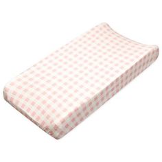 a pink and white checkered crib mattress with the cover pulled down to show it's bottom