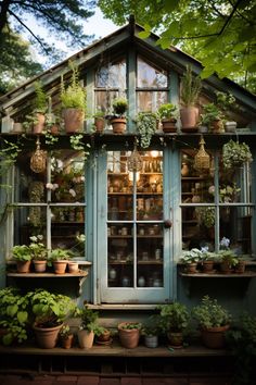 an old greenhouse is filled with potted plants