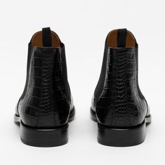 Meet the Hiro Boot in Midnight. This boot features a bold update on this classic chelsea style. The upper is constructed from boxcalf leather from Italy. The counter is also constructed with a full grain leather, but uniquely features an embossed croc detailing. The interior is fully-lined with natural calfskin and the sole unit is stacked leather with a rubber insert. The Hiro Boot in Midnight is made with Blake Construction. This will be an instant favorite. UPPER: Italian BoxcalfCOUNTER: Embo Black Leather Chelsea Boots, Favorite Boots, Mens Black Leather, Leather Chelsea Boots, Boot Accessories, Midnight Black, Chelsea Boot, Winter Accessories, Black Ankle Boots