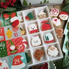 decorated christmas cookies in an ice tray on a table