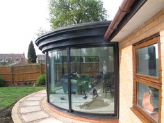 an outside view of a house with large glass windows