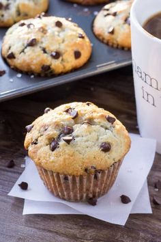 chocolate chip muffins sitting next to a cup of coffee