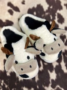 Mooove around with style and ease in these super soft and stylish cow-print Moooving Around the House Slippers. Whether you prefer black and white or brown and white, you'll look "udderly" adorable with horns! Cushiony plush fabric will keep your feet nice and comfy as you move around with a hard sole for support. Mooove it! Plush Fabric, House Slippers, Cow Print, The House, Cow, Slippers, Black White, Black And White, Fabric