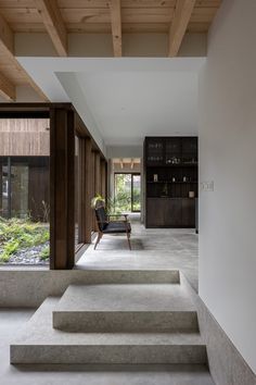 the interior of a modern house with stone steps