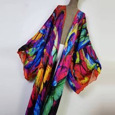 One Size fits S-3X/4X Kimono length: 58inch Material: Poly Silk (a lightweight, smooth, and shiny fabric that drapes and flows very well. An affordable alternative to silk) One Size Fits Most Size Chart Multicolor Silk Kimono For Beach Cover-up, Summer Multicolor Silk Kimono, Multicolor Flowy Wrap Kimono, Flowy Multicolor Wrap Kimono, Multicolor Flowy Long Kimono, Flowy Multicolor Long Kimono, Multicolor Long Flowy Kimono, Multicolor Long Silk Kimono, Long Multicolor Silk Kimono