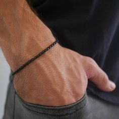 "Looking for a gift for your man? You've found the perfect item for this!  Introducing our versatile and stylish dainty stainless steel bracelet, designed exclusively for men who appreciate a touch of elegance in their accessories. Crafted with meticulous attention to detail, this bracelet is available in three timeless colors: gold, silver, and black. Made from high-quality stainless steel, it boasts exceptional durability, ensuring it will withstand the test of time. The sleek and minimalistic design adds a modern touch to any outfit, making it perfect for everyday wear or special occasions. Whether you're looking to make a fashion statement or gift someone a sophisticated accessory, this dainty stainless steel bracelet is a must-have addition to any gentleman's jewelry collection. Brace Minimalist Stainless Steel Chain Bracelet For Friendship, Minimalist Stainless Steel Friendship Bracelet, Adjustable Chain Bracelet As Gift, Adjustable Durable Chain Bracelet As Gift, Durable Adjustable Chain Bracelet As A Gift, Durable Adjustable Chain Bracelet For Gift, Durable Braided Bracelet For Gift, Durable Braided Bracelet For Gifts, Minimalist Black Chain Bracelet