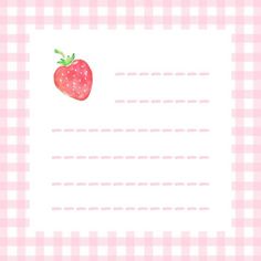 a strawberry on a pink and white checkered table cloth with a blank paper for writing