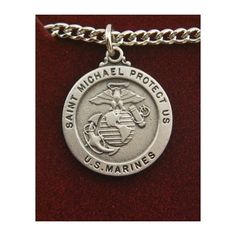 a marine emblem on a silver chain