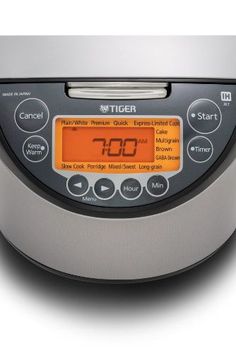 a digital pressure cooker with timers on the front and back sides, showing time