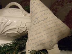 a white christmas tree ornament sitting on top of a table