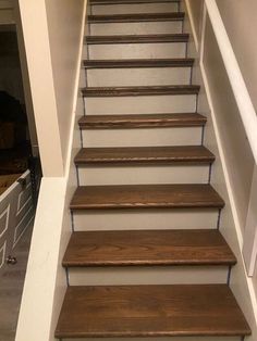 a set of wooden stairs leading up to a second floor