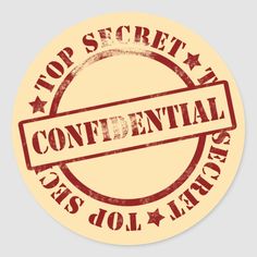 a round sticker with the words, top secret and content