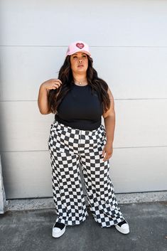 Ace Of Spades Checkered Pants These pants fit true to size Elastic waistband Extra cozy sweatshirt material Wide leg silhouette 1X: 14-16, 2X: 18-20, 3X: 20-22 Level up your style with our Ace Of Spades Checkered Pants! These plus size pants are the perfect addition to your closet for an edgy, yet casual look. Show off your unique style with these one-of-a-kind checkered pants! Eccentric Outfits Plus Size, Checkered Pants Outfit, Spanish Outfits, Streetwear Plus Size, Checkered Pants, Maxi Jumpsuit, 2024 Style, Ace Of Spades, Pants Fit