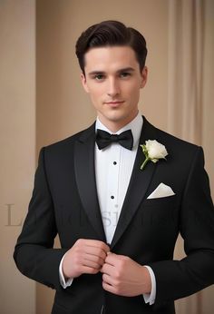 a young man in a tuxedo is adjusting his bow tie