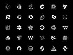 various white symbols are shown on a black background, including arrows and other things that appear to be in the shape of letters