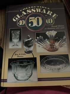 an old glassware book is open on the table