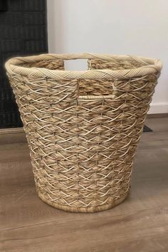 a large wicker basket sitting on the floor