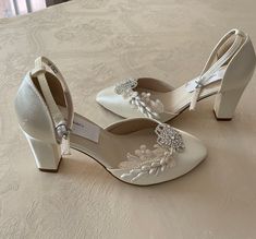 "Bling Wedding shoes closed toes, square heels, ankle straps. Featuring a beautiful crystals flowers, vintage lace appliqués, and vintage asares. I only have materials for 14 pairs. Heel: 2.5\" EVERY SHOES ORDER IS HAND EMBELLISHED IN ORDER OF ARRIVAL THEREFORE,  SHOES CAN NOT BE RETURNED OR EXCHANGED; PLEASE CONFIRM YOUR SIZE FOR THESE SHOES WITH MEASURING FEET LENGHT GUIDE,PLEASE CONTACT ME FOR SIZE CHART OR ANY HELP.  I will try with the best of my abilities to help you have a very pleasant shopping experience. Colors: White, Off-white, and Ivory. US Sizes: 5, 5.5, 6, 6.5, 7, 7.5, 8, 8.5, 9, 9.5, 10. M width. Outside USA, please goggle a shoe size chart converter, or contact for help! Style: Vintage 20's -40's  Great Gatsby, Flapper shoes! Please look at all the pictures TO BUY COLOR SW Vintage Wedding Shoes 1920s Style, Vintage White Heels For Formal Occasions, Vintage White Heels For Wedding, Vintage Closed Toe Wedding Shoes, Great Gatsby Shoes, Vintage High Heel Wedding Shoes, Flapper Shoes White, Old Hollywood Shoes, 1940s Wedding Shoes