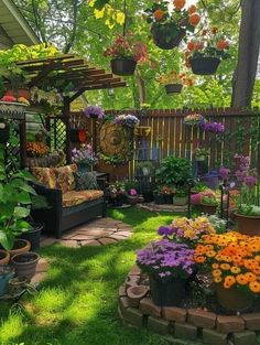 a garden with lots of potted plants and flowers