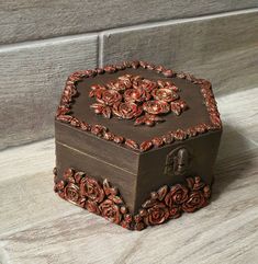 a decorative wooden box sitting on top of a counter