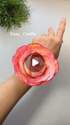 a woman's arm with a flower on it and the words easy crafts written in front of her