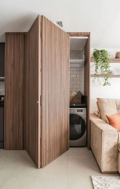 a living room filled with furniture and a washer