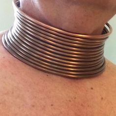 This authentic tribal style neck coil comes to you ready to form in place for a dramatic lifestyle look.  This solid copper neckpiece is a true replica of the traditional neck coils (Idzilla) made famous by natives of Africa and Southeast Asia. Just like the originals this neckpiece requires some effort to fit correctly using traditional forming techniques. Once in place this neck coil can remain as long as you like. Comfortable, durable, and distinctive the inventors of this style wear these neck coils for extended periods. No snaps, no hinges, no pins, no plastic, no nonsense, no kidding. Medium weight soft copper wire is the real thing. Massive yet comfortable once in place.  Each piece is formed in 15" circumference circular shape as shown in photos. The coil is shipped to you in an ex Neck Rings, Rings Style, Coil Bracelet, Metallic Copper, Copper Red, Moon Shapes, Plastic Molds, Choker Necklaces, Metal Bracelets