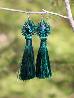 Looking for luxurious tassel earrings for special occasions? Look no longer! You have just found beautiful hand embroidered earrings with emerald green Swarovski rivoli crystals and long green tassel. These pretties were made with love using Swarovski crystals, faceted glass crystals, Japanese TOHO beads, felt for the bottom side and long tassels. All in matching tones of emerald green and green. Ear wires are silver plated lever back type. Total length is 12 cm (4.7 inch) Total width is 3 cm (1 Bead Embroidery Earrings, Green Tassel Earrings, Embroidery Earrings, Embroidered Earrings, Toho Beads, Earrings Bohemian, Earrings Long, Bead Embroidery, Faceted Glass