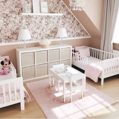 a baby's room with pink and white decor