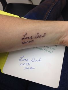 a person with a tattoo on their arm that says lone dad and i love you