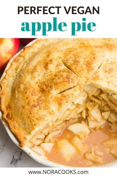 an apple pie is cut in half and served on a white plate with the words, perfect vegan apple pie