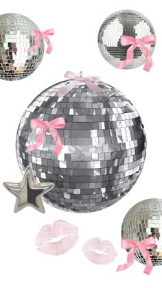 three shiny disco balls with pink bows and ribbons around them, one in the shape of a star