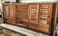 a large wooden cabinet sitting on top of a counter