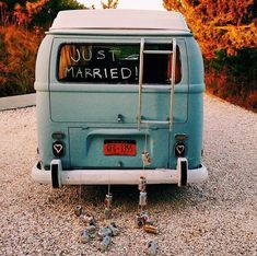 an old blue van with just married written on it