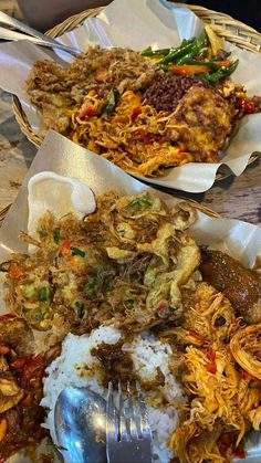 two baskets filled with different types of food