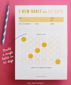 a printable new habit book with a straw next to it on a pink surface