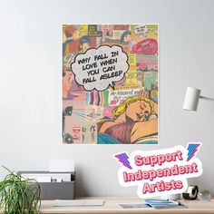 an office desk with a poster above it that says support independent artists