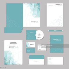 stationery set with business cards and envelopes in blue color on grey background,